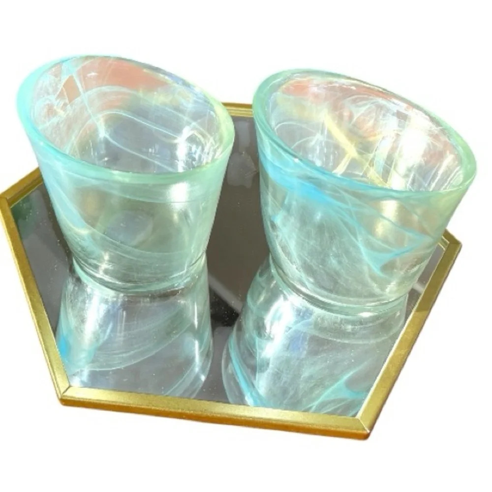 Blue swirl tea light holders with asymmetrical edges, unsigned